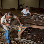 Portugal, Algarve, São Braz de Alportel. 2013. The NovaCortiça cork factory. The cork bark is being cut into thin slices.