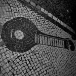 Portugal, Lisbon, 2011. Homage to the Portuguese Fado guitar in the pavement of the Mouraria neighbourhood, home to Fado music.