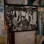 Portugal, Lisbon, 2012. In the workshop of Oscar Cardoso, one of the most prominent builders of the Portuguese guitar for Fado music. The photograph on the wall shows Oscar's father Manuel Cardoso.