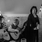 Portugal, Lisbon. 2015. A Fado singer and musicians in a restaurant in the Alfama neighbourhood.