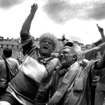 Portugal, Lisbon, 2004. Portuguese and Dutch football supporters dance before the start of the match between Portugal and Holland during the Euro 2004 Championship.