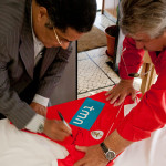 Portugal, Lisbon. 2012. International and legendary football player Eusébio da Silva Ferreira (1942-2014) signs a shirt for a fan.