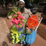 Guinea-Bissau, Bissau,  2008. Street vendor selling Christmas decorations.