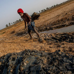 Guinea-Bissau, Cacheu province, Djobel. 2013. The régulo, traditional leader, reinforces the dike surrounding his rice field as a preparation for the new farming season that starts in the month of June.