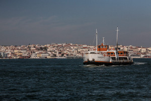 Portugal, Lisbon. 2011. The ferry boat between Cais do Sodré and Cacilhas on the southern bank of the River Tagus with the cityscape of Lisbon in the background.