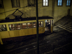 Portugal, Lisbon, Bairro Alto. 2008. The conductor of the Glória funicular waits for clients late in the evening.