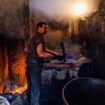 Morocco, Marrakech. 2010. Textile dyer at work in the Souk of Sebbaghine.