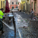 Portugal, Lisbon, Bairro Alto. 2014. The morning after: municipal workers clean the streets filled with litter in the early morning in Bairro Alto, a popular nightspot.