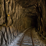 Portugal, Trâs-os-Montes. 2015. The railway tunnel 'Tunel das Fragas Mas' of the Tua railway, constructed in 1887, is part of one of 
the world's most spectacular tracks. A dam was completed near the town of Tua mid 2016. About 25 kilometers of the railway track and of the Tua valley are being submerged thus destroying unrivalled natural beauty. The changing micro climate is also expected to affect the nearby Douro valley, a major wine producing area as well as UNESCO World Heritage.