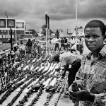 Zimbabwe, Harare. 1996.  A man sells his sculptures at the Avondale shopping center.