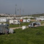 Portugal, Algarve, near the town of Lagos. 2017. Improvised camping site with recreational vehicles.