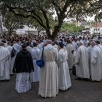 Portugal, Estremadura, Cova de Iria, Fatima. 2017. A large group of priests prepares for its participation on the candle procession in the sanctuary of Fatima.